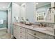 Bathroom featuring a double vanity with granite countertops, updated fixtures, and ample storage space at 5101 Gamton Ct, Charlotte, NC 28226