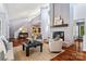 Spacious living room with a grand fireplace, hardwood floors, and ample natural light at 5101 Gamton Ct, Charlotte, NC 28226