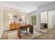 Bright office space featuring a modern desk, ample natural light, and spacious closet at 5101 Gamton Ct, Charlotte, NC 28226