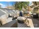 Outdoor patio with comfortable seating, including a stylish wicker sofa and chairs, perfect for entertaining at 5101 Gamton Ct, Charlotte, NC 28226