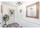 Bright, modern entryway featuring gray wood floors, white wainscoting, and an attractive glass paneled door at 604 White Oak Ct, Gastonia, NC 28056