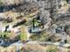 Aerial view of property showing the layout of the land, mature trees, and proximity to the road at 624 Patricia Ave, Harrisburg, NC 28075