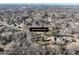 Aerial view with street address marker of a property amid a neighborhood with mature trees at 624 Patricia Ave, Harrisburg, NC 28075