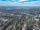 A high aerial view of a neighborhood reveals mature trees and single-Gathering homes at 624 Patricia Ave, Harrisburg, NC 28075