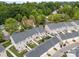 Townhome complex with back patios, mature trees, garages, and ample yard space at 6846 Colonial Garden Dr, Huntersville, NC 28078