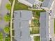Aerial view of townhomes with backyard patio areas and lush greenery, showcasing community layout at 6846 Colonial Garden Dr, Huntersville, NC 28078
