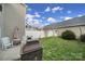 Fenced backyard featuring grass, a patio area, and an outdoor fire pit at 6846 Colonial Garden Dr, Huntersville, NC 28078