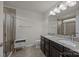 Bathroom features a double sink vanity with granite counters and tile flooring at 6846 Colonial Garden Dr, Huntersville, NC 28078