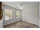 Bedroom with fan and bright windows looking into the backyard at 6846 Colonial Garden Dr, Huntersville, NC 28078