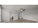 Empty bedroom boasts neutral walls, a ceiling fan, and two doorways at 6846 Colonial Garden Dr, Huntersville, NC 28078