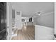 Bright entryway with views of the stairs, kitchen, and durable flooring at 6846 Colonial Garden Dr, Huntersville, NC 28078