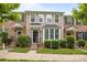 Charming townhouse featuring brick and vinyl siding, a well-manicured lawn, and inviting front entrance at 6846 Colonial Garden Dr, Huntersville, NC 28078