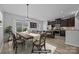 Open kitchen and dining area with stainless steel appliances and dining table with seating at 6846 Colonial Garden Dr, Huntersville, NC 28078