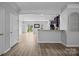Open-concept living space with durable flooring and views of the backyard through sliding doors at 6846 Colonial Garden Dr, Huntersville, NC 28078