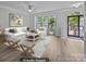 Bright and airy living room featuring neutral paint, wood flooring, and lots of natural light at 6846 Colonial Garden Dr, Huntersville, NC 28078
