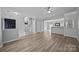 Spacious open-concept living area with stairs, durable flooring and neutral colors at 6846 Colonial Garden Dr, Huntersville, NC 28078