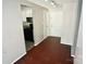 View of the entryway with wood floors and leading to the kitchen and the front door at 7228 Rollingridge Dr, Charlotte, NC 28211