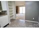 View of the living room with sliding glass door at 7228 Rollingridge Dr, Charlotte, NC 28211