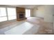 View of the living room showcasing a fireplace with brick surround at 7228 Rollingridge Dr, Charlotte, NC 28211