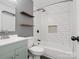 Modern bathroom with white subway tile shower and floating wood shelves at 724 Merridale Dr, Charlotte, NC 28214