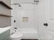 Modern bathroom with white subway tile shower and floating wood shelves at 724 Merridale Dr, Charlotte, NC 28214