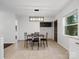 Dining area with contemporary light fixture and view to the outdoors at 724 Merridale Dr, Charlotte, NC 28214