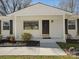 Close up of front entrance with nice landscaping and hardscape at 724 Merridale Dr, Charlotte, NC 28214