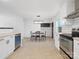 Open kitchen and dining area with stainless steel appliances and modern lighting at 724 Merridale Dr, Charlotte, NC 28214