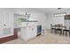 Eat-in kitchen features white cabinets, stainless steel appliances, and an island at 724 Merridale Dr, Charlotte, NC 28214