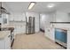 Bright kitchen features white cabinets, stainless steel appliances, and modern finishes at 724 Merridale Dr, Charlotte, NC 28214