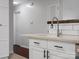 Bright kitchen featuring white cabinets, a stainless steel faucet, and subway tile backsplash at 724 Merridale Dr, Charlotte, NC 28214