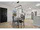 Bright eat-in kitchen featuring white cabinets, stainless appliances and subway tile backsplash at 724 Merridale Dr, Charlotte, NC 28214