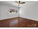 Light filled living room with newly refinished hardwood floors at 724 Merridale Dr, Charlotte, NC 28214