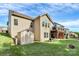 Large backyard featuring a shed for storage, a wooden deck, a grassy lawn, and a fire pit at 7343 Mill Ruins Sw Ave, Concord, NC 28025