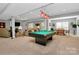 The finished basement features recessed lighting, a billiards table, carpeted floors, and a dining area at 7343 Mill Ruins Sw Ave, Concord, NC 28025