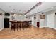 This basement bar includes a long wooden countertop, seating for five, and a beverage cooler at 7343 Mill Ruins Sw Ave, Concord, NC 28025