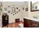 Quirky bathroom design featuring a dark wood vanity, sports themed decor, and wood laminate flooring at 7343 Mill Ruins Sw Ave, Concord, NC 28025