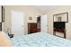 Comfortable bedroom featuring a queen bed, dresser, and TV at 7343 Mill Ruins Sw Ave, Concord, NC 28025