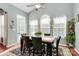 Dining room with ceiling fan, lots of windows with coverings, and view to the deck at 7343 Mill Ruins Sw Ave, Concord, NC 28025