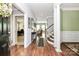 Spacious foyer with hardwood floors and elegant staircase at 7343 Mill Ruins Sw Ave, Concord, NC 28025