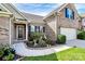 Inviting front entrance with elegant door decor and landscaping at 7343 Mill Ruins Sw Ave, Concord, NC 28025