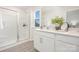 Bright bathroom with double vanity, white cabinets, shower, and ample counter space at 808 N Naughton St, Chester, SC 29706