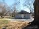 The back exterior shows the large drive and simple siding at 934 W Nc 150 Hwy, Lincolnton, NC 28092