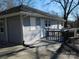 The home's back exterior shows a small deck, siding, and rain gutters at 934 W Nc 150 Hwy, Lincolnton, NC 28092