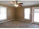 The bedroom has plush carpet and two windows for tons of natural light at 934 W Nc 150 Hwy, Lincolnton, NC 28092