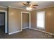 A cozy bedroom with neutral walls, carpet flooring, and a ceiling fan with light at 934 W Nc 150 Hwy, Lincolnton, NC 28092