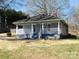 Charming single-story home featuring a welcoming front porch and a well-maintained front yard at 934 W Nc 150 Hwy, Lincolnton, NC 28092