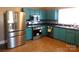 The updated kitchen features stainless steel appliances and tile backsplash at 934 W Nc 150 Hwy, Lincolnton, NC 28092