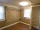 An open walk-in closet with shelving, tiled floors, and natural light coming in from the window at 934 W Nc 150 Hwy, Lincolnton, NC 28092