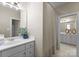 Bright bathroom features a shower-tub combo with white vanity and decorative accents at 1025 Seminole Dr, Waxhaw, NC 28173